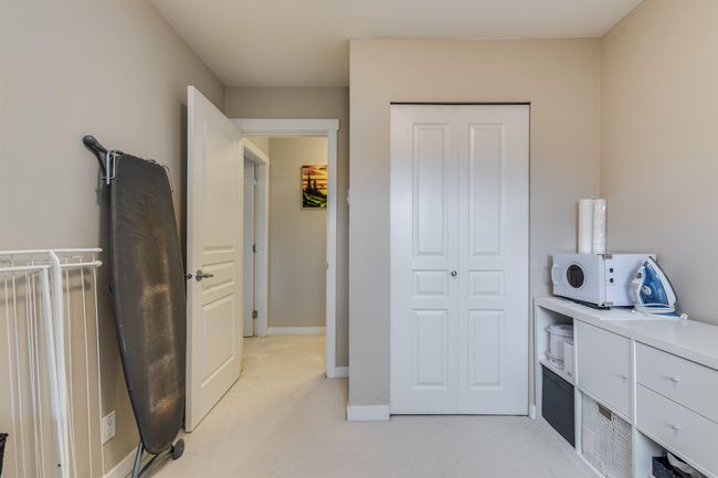 Bedroom featuring baseboards, a closet, and light colored carpet | Image 17