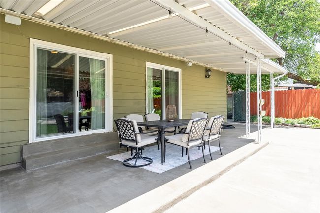View of patio featuring outdoor dining space | Image 44