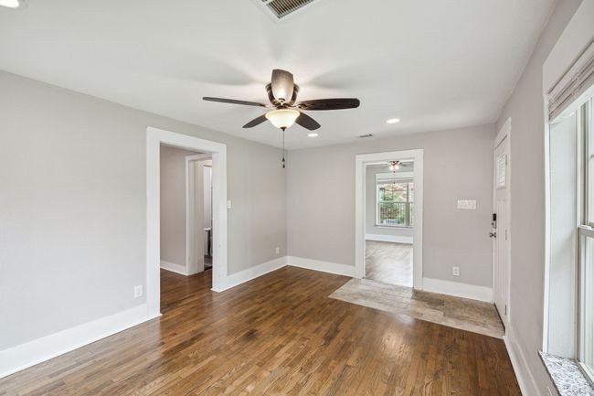 Unfurnished room with recessed lighting, dark wood-style floors, and a ceiling fan | Image 6