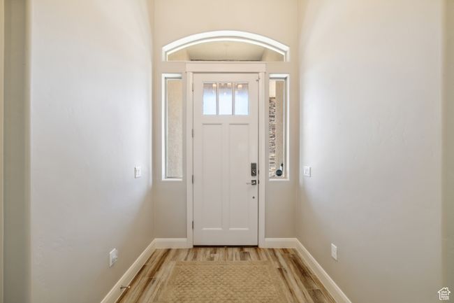 Foyer entrance with light wood-style flooring and baseboards | Image 22