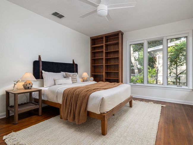 Bedroom featuring wood flooring and a ceiling fan | Image 19