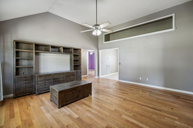 The expansive great room, featuring a vaulted ceiling, freshly painted walls, and sleek bamboo flooring, exude a modern elegance that is both inviting and spacious! 2095 Bolden Drive, Murfreesboro, TN 37127 | Image 5