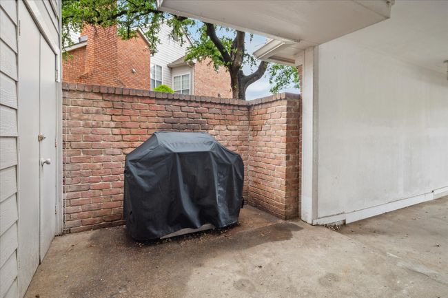 Grill area outside of garage. | Image 14