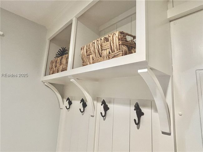 Mudroom built-in bench area with seahorse hooks | Image 41