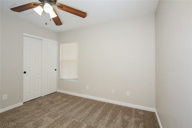 Unfurnished bedroom featuring baseboards, a ceiling fan, carpet floors, and a closet | Image 7