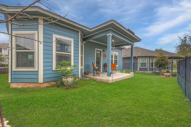 Rear view of property with a yard, a patio area, and fence | Image 33