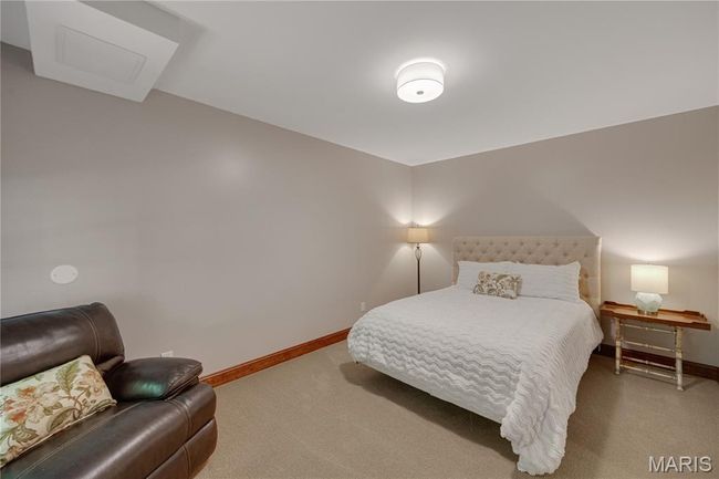 Carpeted bedroom featuring baseboards | Image 56