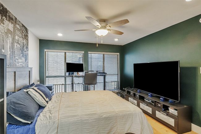 Bedroom with wood finished floors, recessed lighting, and ceiling fan | Image 9