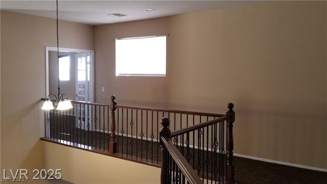 Staircase with carpet floors and baseboards | Image 14