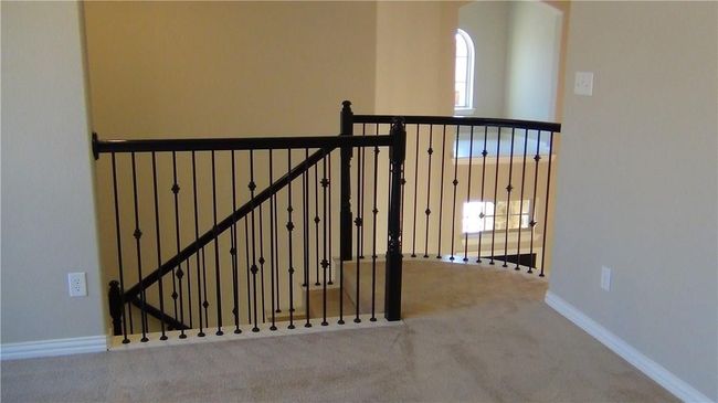 Staircase with carpet floors and baseboards | Image 12