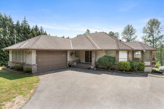 Single story home with an attached garage and driveway | Image 5