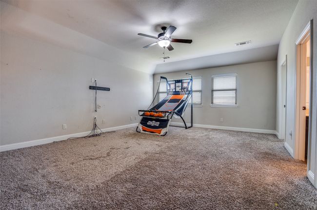 Workout area with carpet and a ceiling fan | Image 26