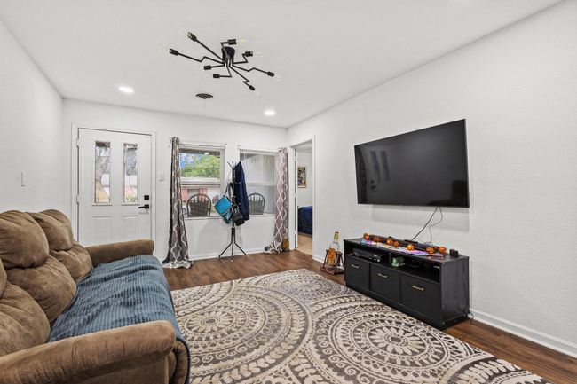 Living room featuring wood finished floors, baseboards, and recessed lighting | Image 4