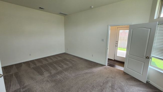 Empty room featuring dark carpet and baseboards | Image 19