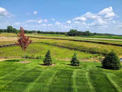 Beautiful views from the rear of the home overlooking a pond and open space. | Image 2