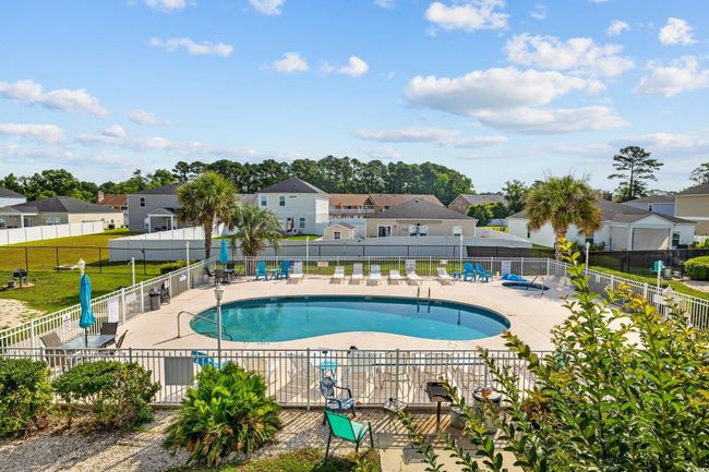 Community pool with a residential view and a patio | Image 20