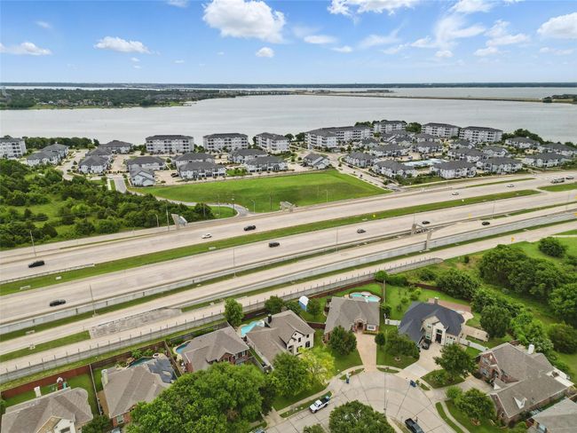 Aerial overview of property's location featuring a large body of water and a main thoroughfare | Image 36
