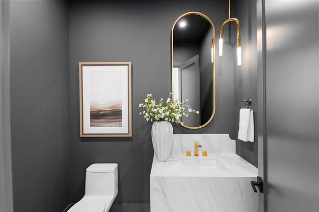 Designed with intention, this half bath pairs bold sophistication with refined materials. | Image 7
