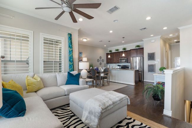 2nd Floor Living area with dark wood-style floors, attic access, visible vents | Image 8