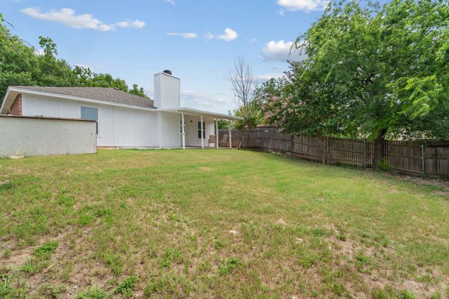 View of fenced backyard | Image 33