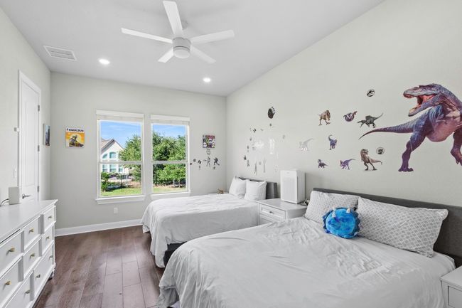 Bedroom with dark wood floors and recessed lighting | Image 29