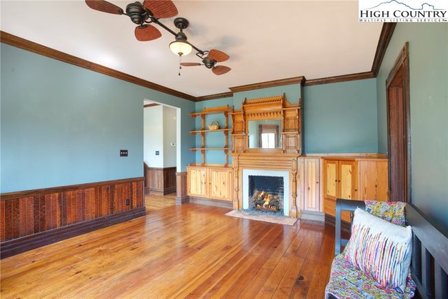 Great room with original fireplace. Mantel and cabinets added recently. | Image 7