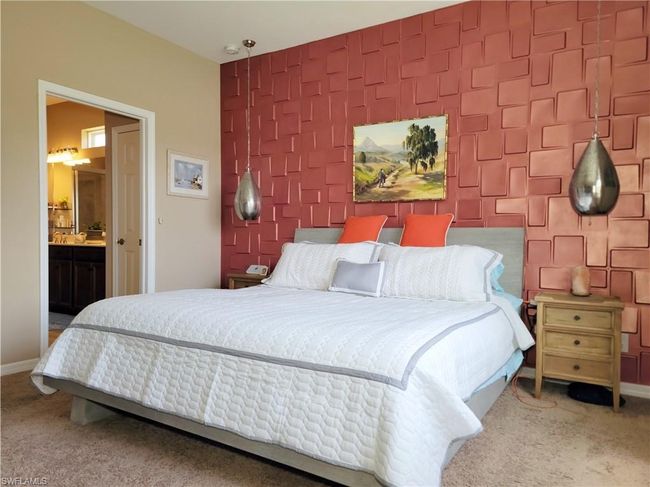 Carpeted bedroom featuring an accent wall and baseboards | Image 27