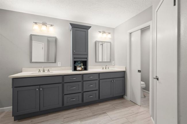Cabinetry was thoughtfully designed with double sets of drawers and stylish countertop cabinet, offering both beauty and practical storage solutions. | Image 27
