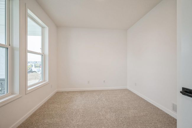Photo is of the actual home. The flex room is a perfect home office. | Image 7