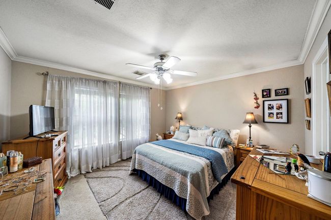 Spacious second bedroom with a large window with natural light. This room is also connected to the upstairs bathroom. | Image 14
