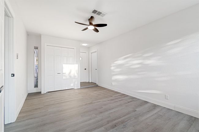 Unfurnished room with light wood-type flooring and ceiling fan | Image 27