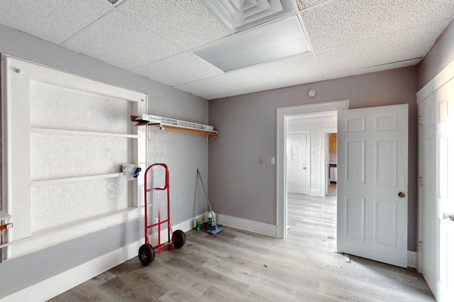 Washroom with light hardwood / wood-style floors | Image 30