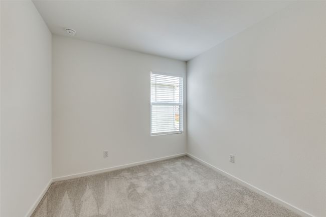 Spare room with light colored carpet and a smoke detector | Image 8