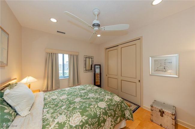 Guest Bedroom 2 featuring visible vents, a closet, recessed lighting, light wood finished floors, and a ceiling fan | Image 43