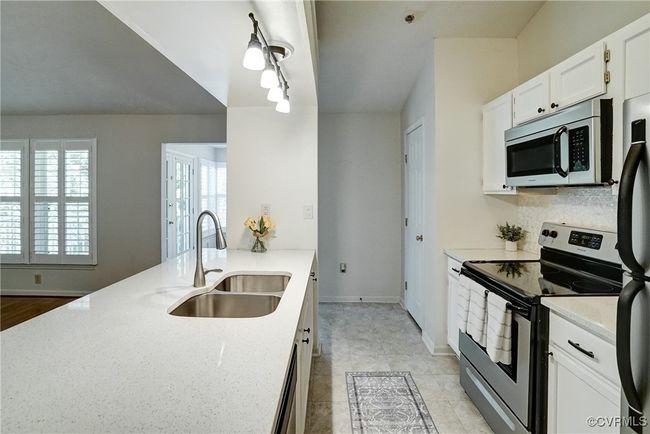 Lots of Counter space with breakfast bar, double sinks - all appliances convey! | Image 17