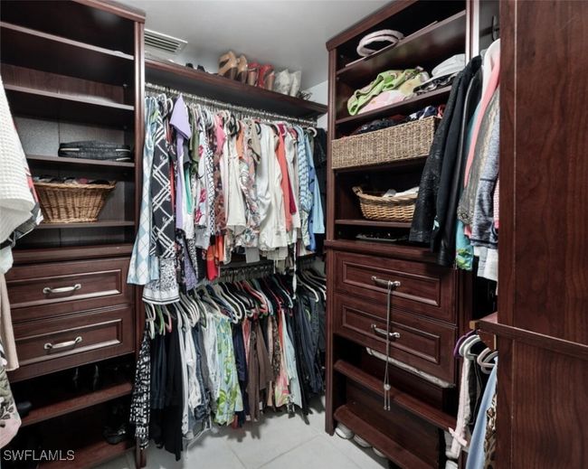 Walk in closet with tile patterned flooring and visible vents | Image 13