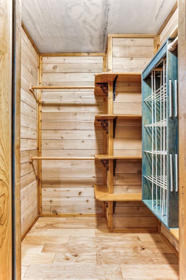 Walk in closet featuring hardwood / wood-style flooring | Image 32