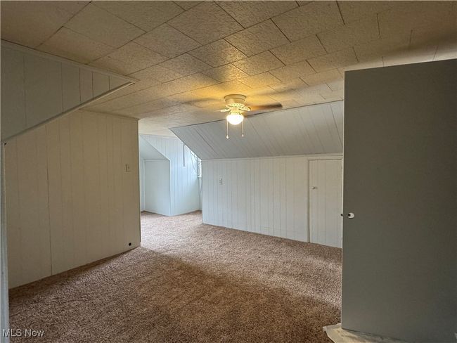 Bonus room featuring light colored carpet and ceiling fan | Image 20