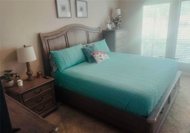 Bedroom #1 of 4 has plenty of natural light. | Image 19