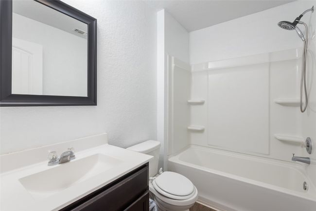 Full bathroom featuring vanity and washtub / shower combination | Image 18