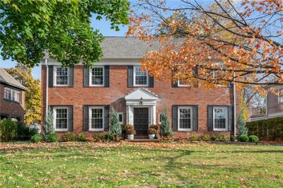 Colonial house featuring a front lawn | Image 1