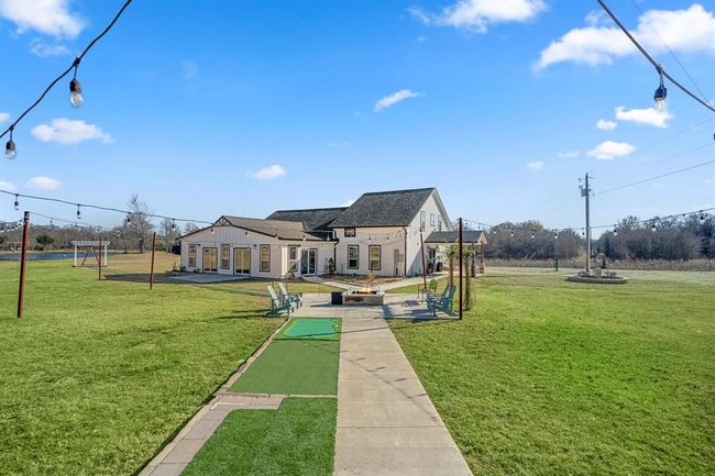 A paved walkway leads from the main home to the other building—connecting the property’s two distinct spaces. | Image 27