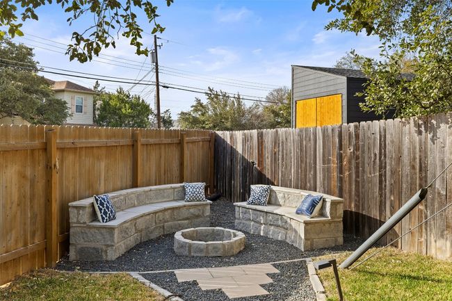 View of patio / terrace with an outdoor fire pit and a fenced backyard | Image 32