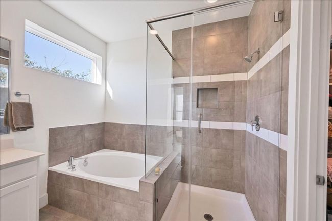 Closer view of the tub and shower in the primary bathroom. | Image 13