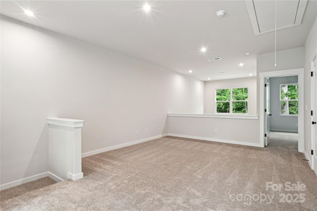 *Representative of the Norman floorplan – not the actual home* Spacious loft and second living area overlooking the stunning 2-story great room. | Image 7