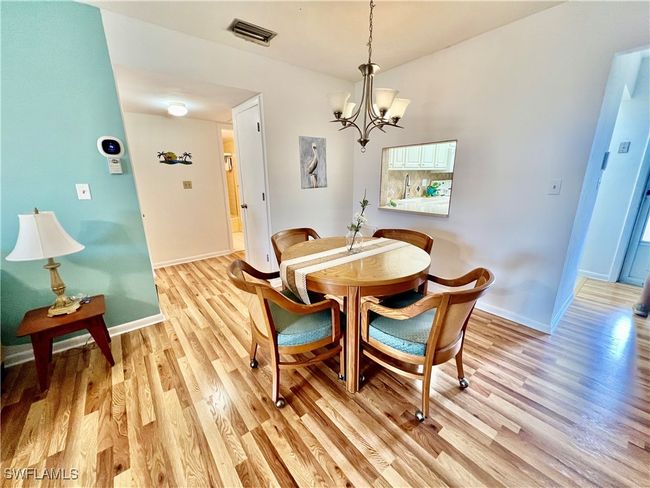 Dining space with baseboards, light wood-style flooring. | Image 11
