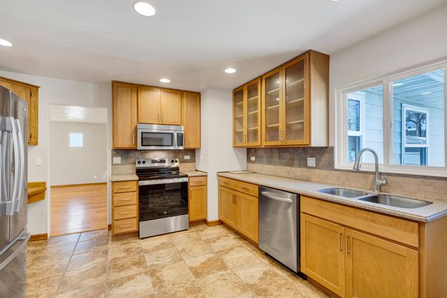 Unfurnished living room with recessed lighting, light wood-style floors, and a baseboard radiator | Image 5