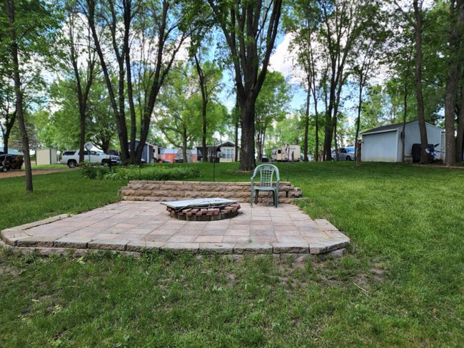 Great firepit area with large patio and retaining wall. | Image 30