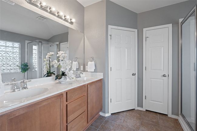 Full bath featuring double vanity and a stall shower | Image 29
