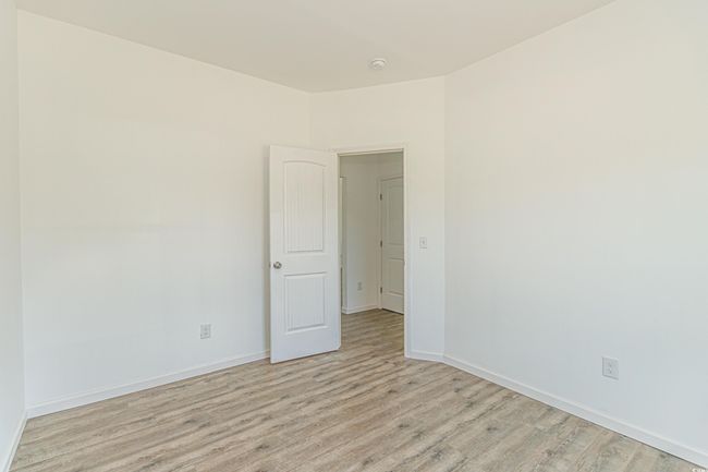 Spare room with light wood-type flooring and baseboards | Image 28
